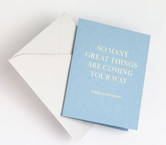 A blue greeting card and a white envelope
